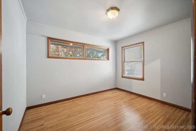 5856 E 22nd St, Tulsa, OK 74114 - unfurnished room with wood finished floors, crown molding, and baseboards