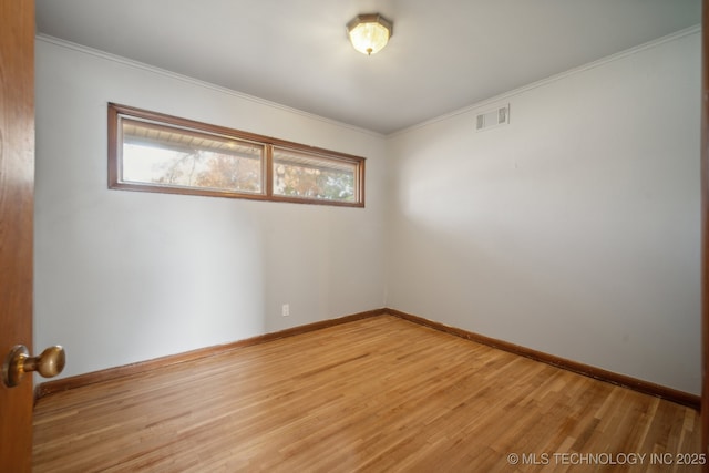 5856 E 22nd St, Tulsa, OK 74114 - empty room featuring light wood-type flooring, baseboards, and crown molding