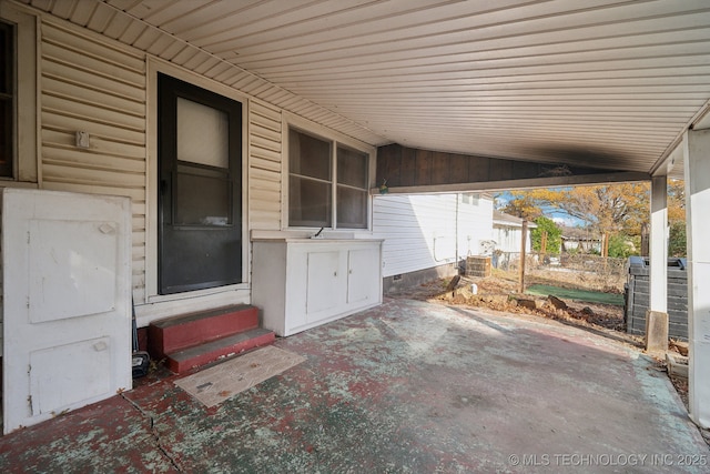 5856 E 22nd St, Tulsa, OK 74114 - view of patio / terrace featuring entry steps, a carport, and central AC unit