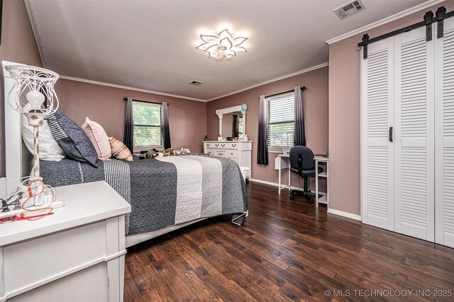302 E Allen, Davis, OK 73030 - bedroom with wood finished floors, a barn door, multiple windows, crown molding, and an office area