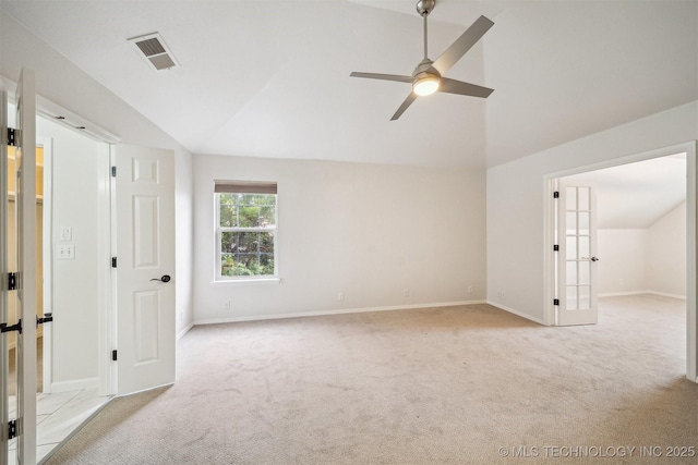 7408 S 94th Ave E, Tulsa, OK 74133 - unfurnished bedroom featuring vaulted ceiling, light carpet, baseboards, and a ceiling fan
