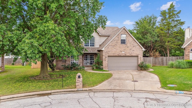7408 S 94th Ave E, Tulsa, OK 74133 - traditional-style house with brick siding, driveway, a garage, and a shingled roof