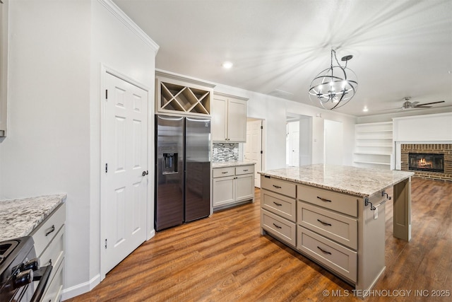 7408 S 94th Ave E, Tulsa, OK 74133 - kitchen with stainless steel fridge with ice dispenser, stove, a ceiling fan, gray cabinets, and recessed lighting