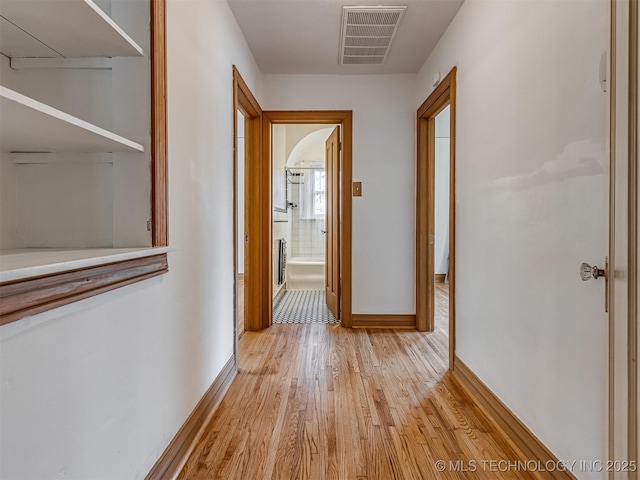 3504 E Haskell St, Tulsa, OK 74115 - hallway with light wood-style flooring and baseboards