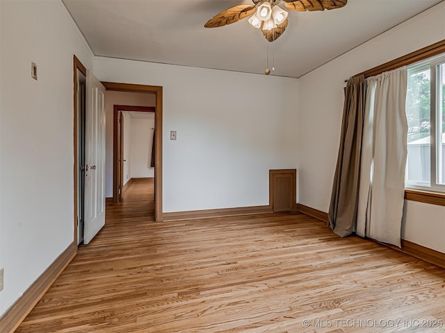 3504 E Haskell St, Tulsa, OK 74115 - spare room featuring light wood finished floors, ceiling fan, and baseboards