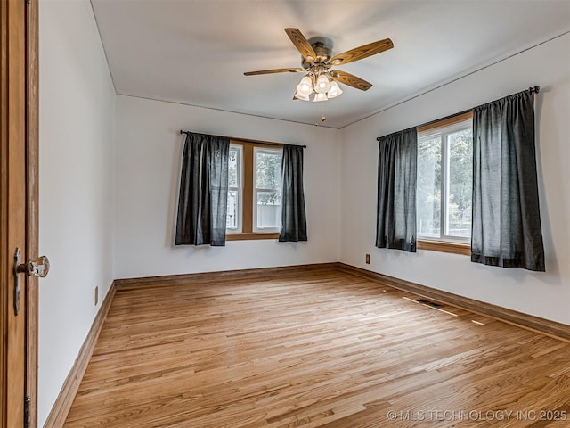3504 E Haskell St, Tulsa, OK 74115 - spare room featuring light wood finished floors, ceiling fan, and baseboards