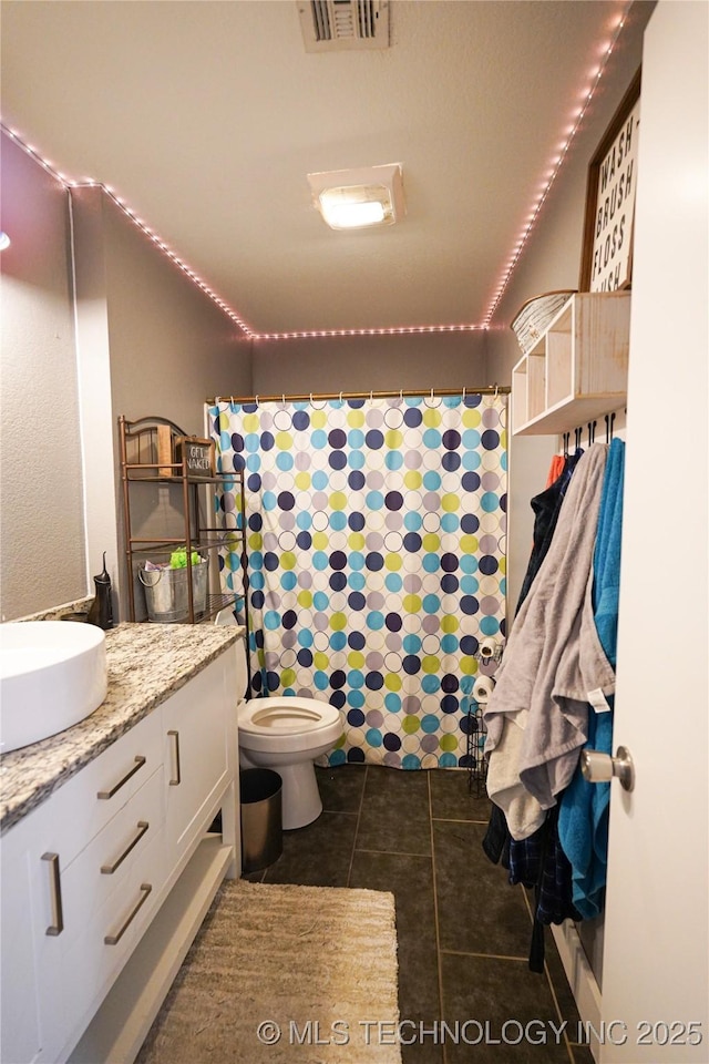 9406 S 161st Ave W, Sapulpa, OK 74066 - full bathroom featuring vanity, tile patterned flooring, toilet, and curtained shower