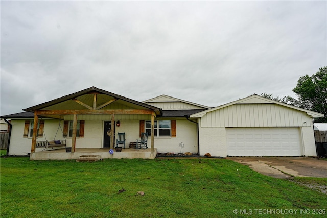 9406 S 161st Ave W, Sapulpa, OK 74066 - view of front of house with brick siding, a garage, covered porch, and a front yard