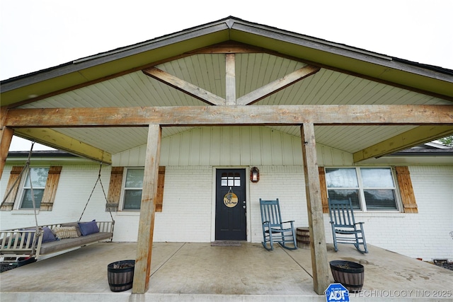 9406 S 161st Ave W, Sapulpa, OK 74066 - doorway to property with brick siding and a porch
