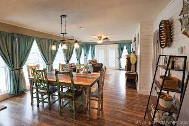 9406 S 161st Ave W, Sapulpa, OK 74066 - dining space featuring dark wood finished floors, healthy amount of natural light, a textured ceiling, and a ceiling fan