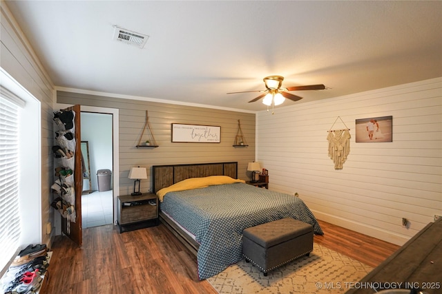 9406 S 161st Ave W, Sapulpa, OK 74066 - bedroom featuring wooden walls, wood finished floors, ceiling fan, and baseboards