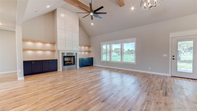 13801 N 54th E Ave, Collinsville, OK 74021 - unfurnished living room featuring plenty of natural light, high vaulted ceiling, light wood-type flooring, baseboards, and recessed lighting