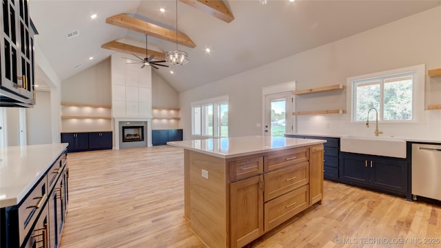 13801 N 54th E Ave, Collinsville, OK 74021 - kitchen with open shelves, dishwasher, a sink, light wood-style flooring, and beam ceiling
