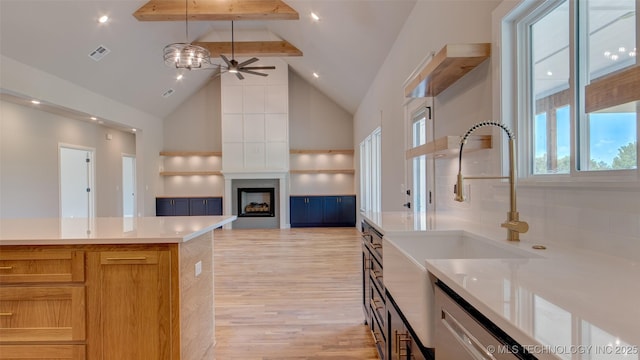 13801 N 54th E Ave, Collinsville, OK 74021 - kitchen with a sink, beamed ceiling, high vaulted ceiling, light wood finished floors, and a fireplace