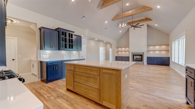 13801 N 54th E Ave, Collinsville, OK 74021 - kitchen featuring beam ceiling, light wood-style flooring, high vaulted ceiling, light countertops, and ceiling fan