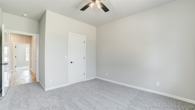 13801 N 54th E Ave, Collinsville, OK 74021 - unfurnished bedroom with carpet floors, baseboards, and ceiling fan