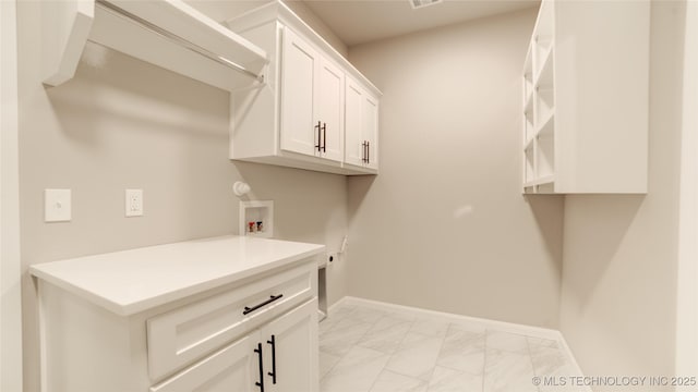 13801 N 54th E Ave, Collinsville, OK 74021 - washroom featuring hookup for a washing machine, light marble finish floors, cabinet space, and baseboards