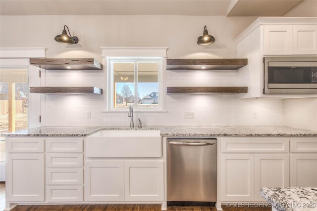 13801 N 54th E Ave, Collinsville, OK 74021 - kitchen featuring appliances with stainless steel finishes, open shelves, a sink, white cabinets, and tasteful backsplash