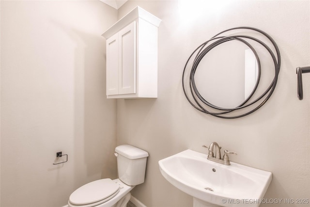 13801 N 54th E Ave, Collinsville, OK 74021 - half bath with a sink, toilet, and baseboards