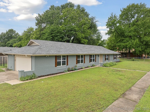 6806 E 74th St, Tulsa, OK 74133 - single story home with an attached garage, driveway, a shingled roof, and brick siding