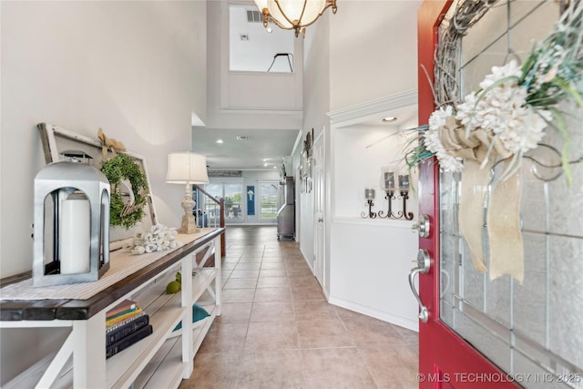 13100 S 4080th Rd, Oologah, OK 74053 - entryway with a towering ceiling, light tile patterned floors, and a chandelier