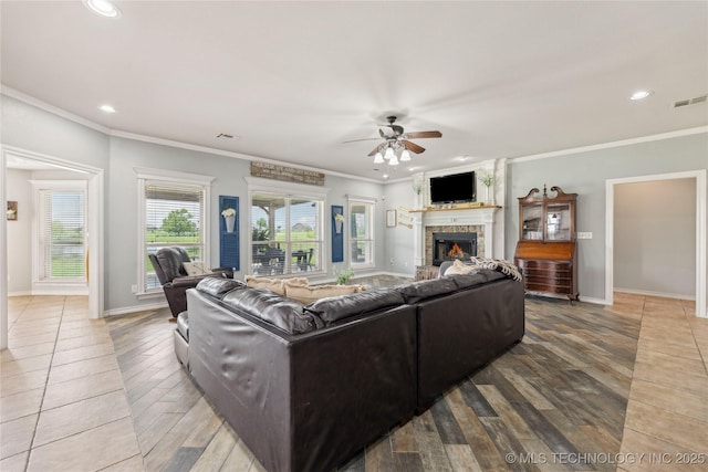 13100 S 4080th Rd, Oologah, OK 74053 - living room with a warm lit fireplace, a ceiling fan, wood finished floors, crown molding, and recessed lighting