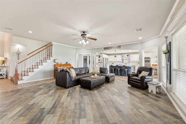 13100 S 4080th Rd, Oologah, OK 74053 - living room featuring stairway, wood finished floors, a ceiling fan, healthy amount of natural light, and recessed lighting