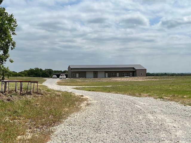 3226 Lark Rd, Kingston, OK 73439 - view of outdoor structure with gravel driveway and a garage