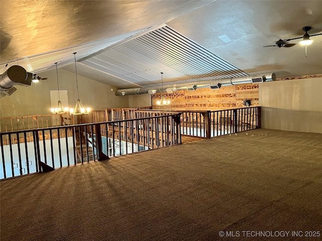 3226 Lark Rd, Kingston, OK 73439 - carpeted spare room with a ceiling fan, a chandelier, and lofted ceiling