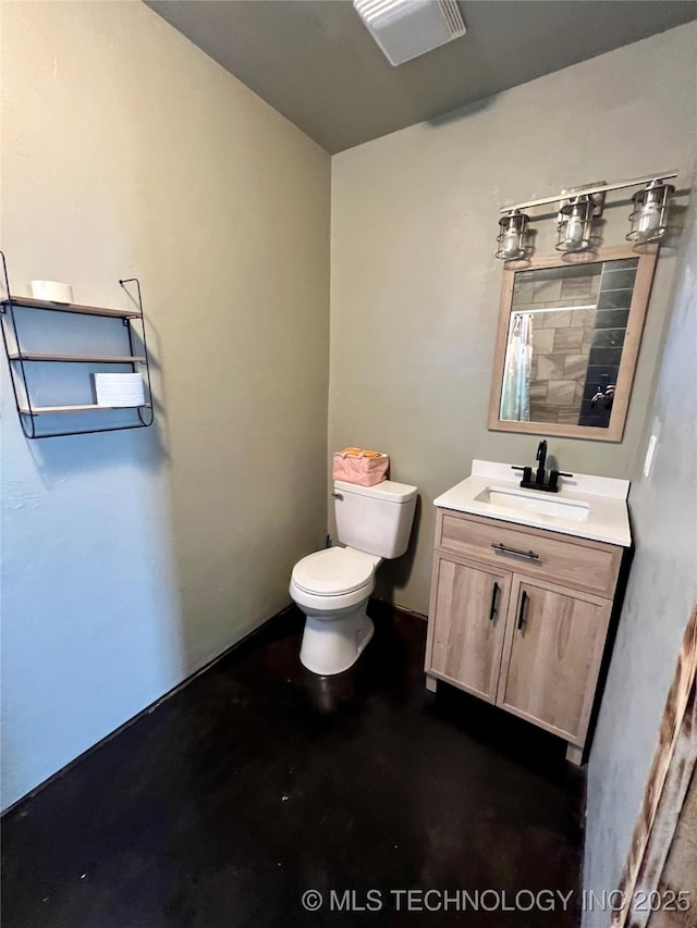 3226 Lark Rd, Kingston, OK 73439 - full bathroom with concrete flooring, toilet, vanity, and a shower with shower curtain