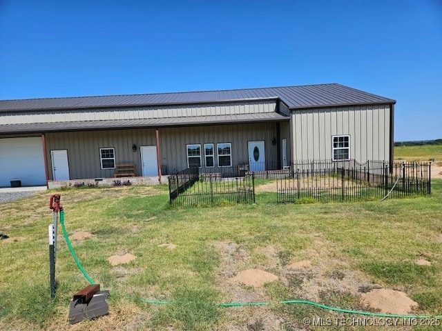 3226 Lark Rd, Kingston, OK 73439 - view of front facade featuring board and batten siding, metal roof, and a garage