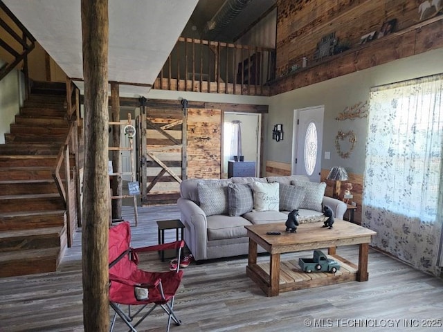 3226 Lark Rd, Kingston, OK 73439 - living area with wood finished floors, stairs, and a high ceiling