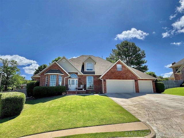 103 S Harrison Ave, Tahlequah, OK 74464 - traditional home with brick siding, driveway, and a garage