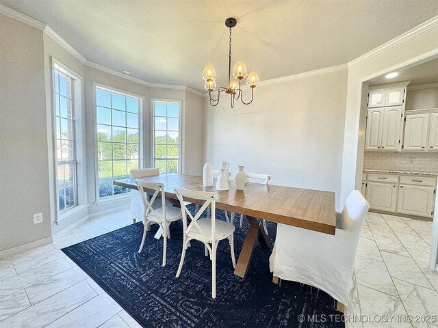 103 S Harrison Ave, Tahlequah, OK 74464 - dining area with light marble finish floors, plenty of natural light, a chandelier, and crown molding
