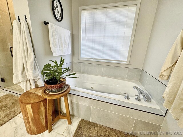 103 S Harrison Ave, Tahlequah, OK 74464 - bathroom featuring a jetted tub and marble finish flooring
