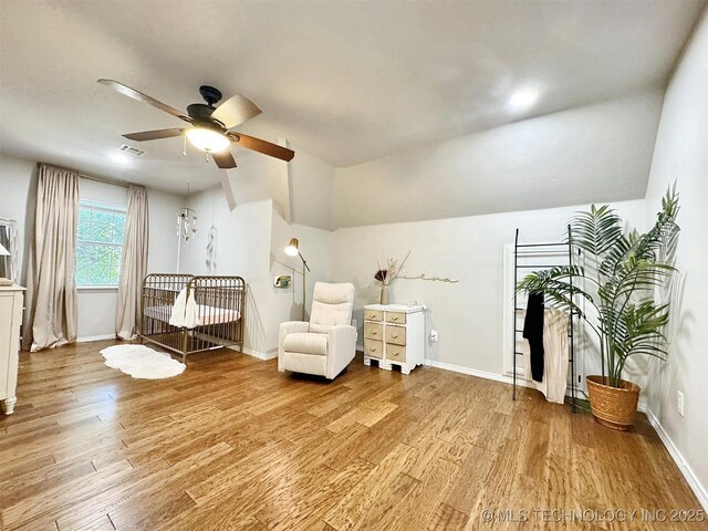 103 S Harrison Ave, Tahlequah, OK 74464 - living area featuring ceiling fan, light wood-style floors, baseboards, and lofted ceiling