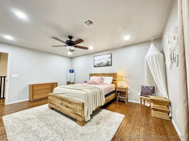 103 S Harrison Ave, Tahlequah, OK 74464 - bedroom with wood finished floors, recessed lighting, baseboards, and ceiling fan