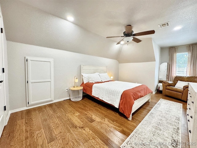 103 S Harrison Ave, Tahlequah, OK 74464 - bedroom with wood finished floors, lofted ceiling, baseboards, ceiling fan, and a textured ceiling