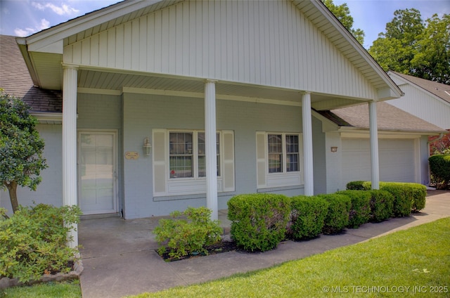 6788 E 66th Pl, Tulsa, OK 74133 - view of front of house with a porch, a garage, and a shingled roof