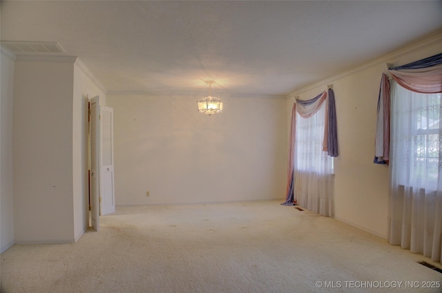 6788 E 66th Pl, Tulsa, OK 74133 - empty room with crown molding, a chandelier, and carpet floors