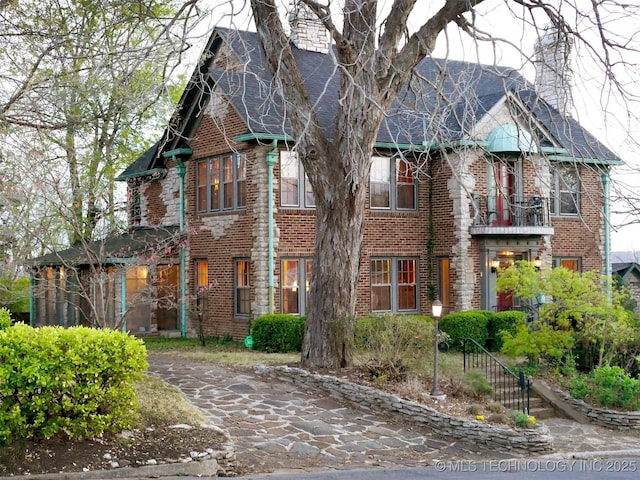 640 W 14th St, Tulsa, OK 74127 - view of front of home featuring brick siding and a shingled roof