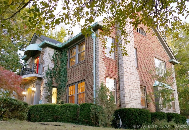 640 W 14th St, Tulsa, OK 74127 - view of property exterior featuring a balcony and brick siding