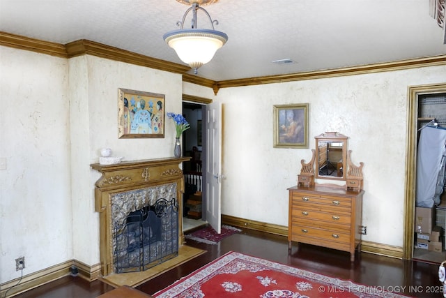 640 W 14th St, Tulsa, OK 74127 - living room featuring ornamental molding, wood finished floors, a premium fireplace, and baseboards