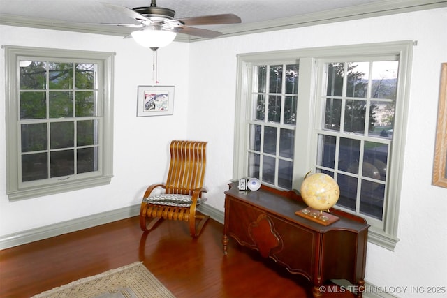 640 W 14th St, Tulsa, OK 74127 - living area with wood finished floors, crown molding, baseboards, and ceiling fan