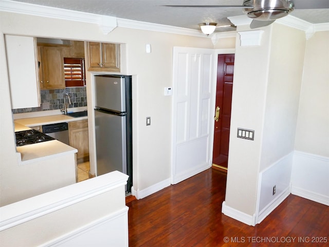 640 W 14th St, Tulsa, OK 74127 - kitchen with stainless steel appliances, a sink, tasteful backsplash, crown molding, and light countertops