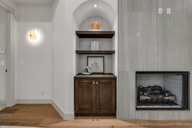 4127 S Cincinnati Ave, Tulsa, OK 74105 - detailed view of wood finished floors, a fireplace, and baseboards