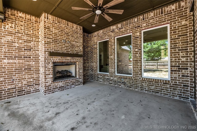4127 S Cincinnati Ave, Tulsa, OK 74105 - view of patio / terrace with a ceiling fan and an outdoor brick fireplace