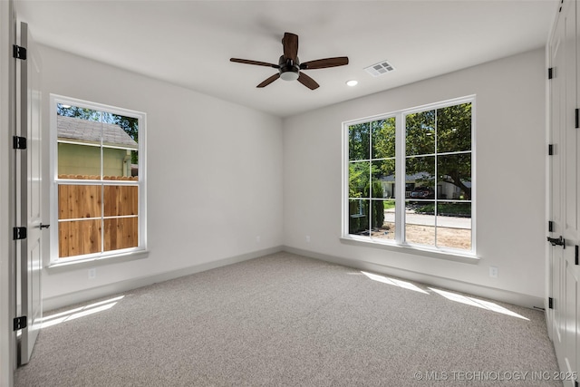 4127 S Cincinnati Ave, Tulsa, OK 74105 - empty room featuring plenty of natural light, carpet flooring, a ceiling fan, and recessed lighting