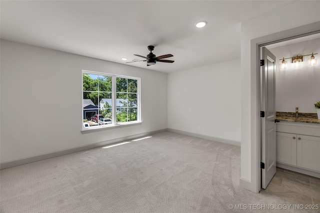 4127 S Cincinnati Ave, Tulsa, OK 74105 - unfurnished bedroom with light carpet, baseboards, recessed lighting, a sink, and a ceiling fan
