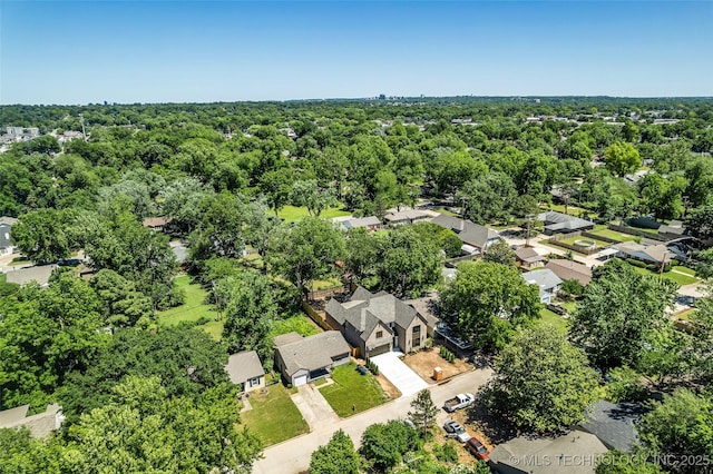 4127 S Cincinnati Ave, Tulsa, OK 74105 - aerial overview of property's location with nearby suburban area and a forest